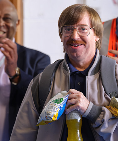 Jeff Smiling whilst holding food