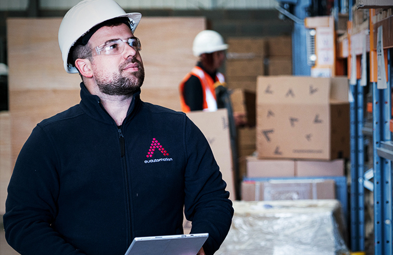 EU Automation Employee holding clipboard